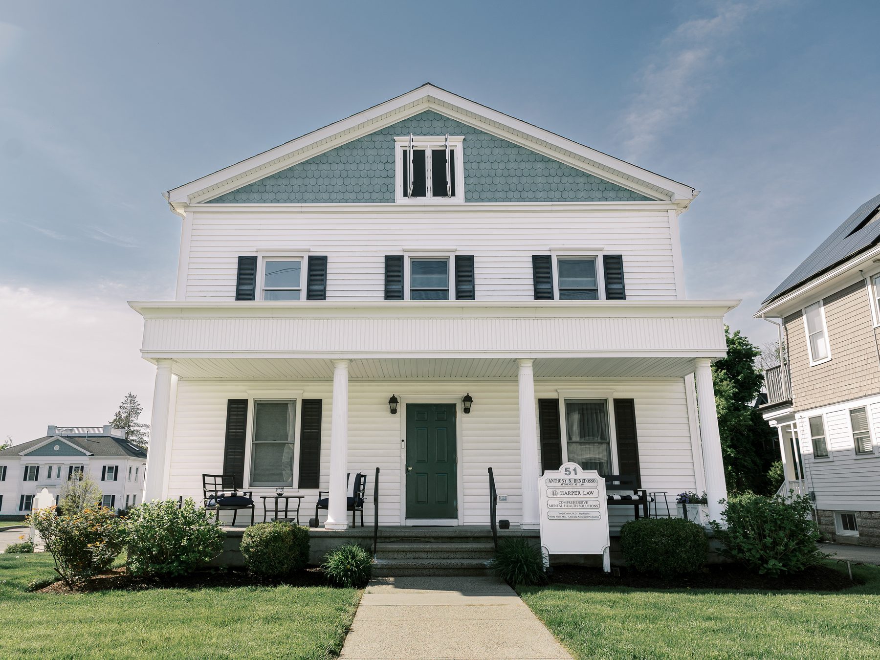 Entrance of 51 Cherry Street, Milford: white colonial with green door