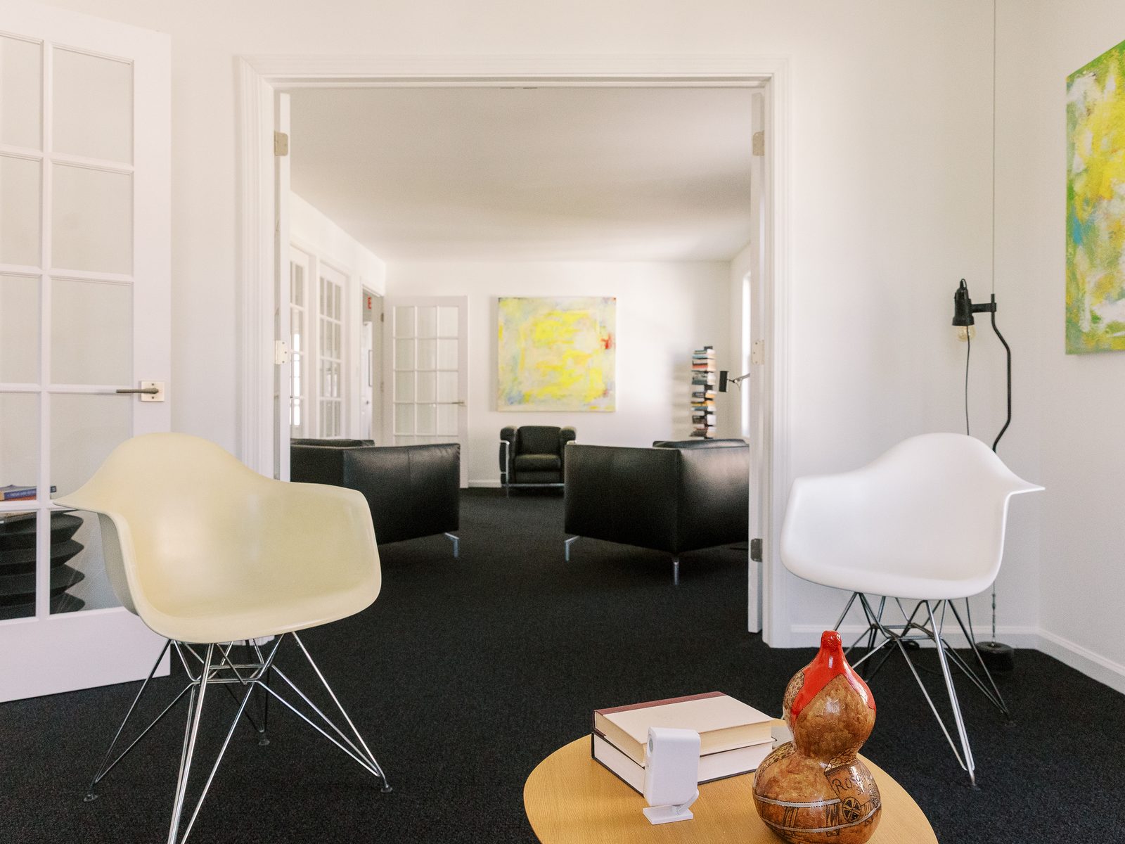 A warm CMHS therapy room in Milford with a comfortable sofa and two chairs