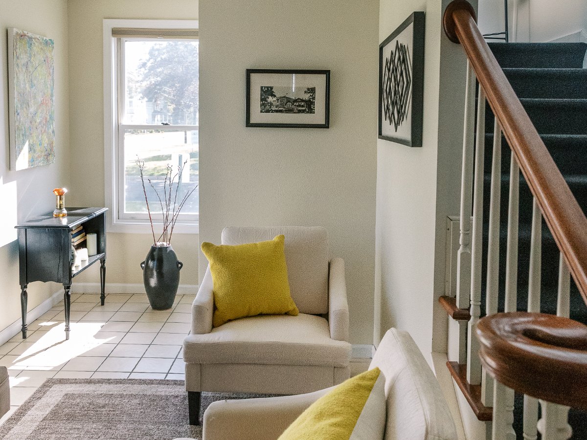 Waiting area at 51 Cherry Street with citron pillows and the staircase