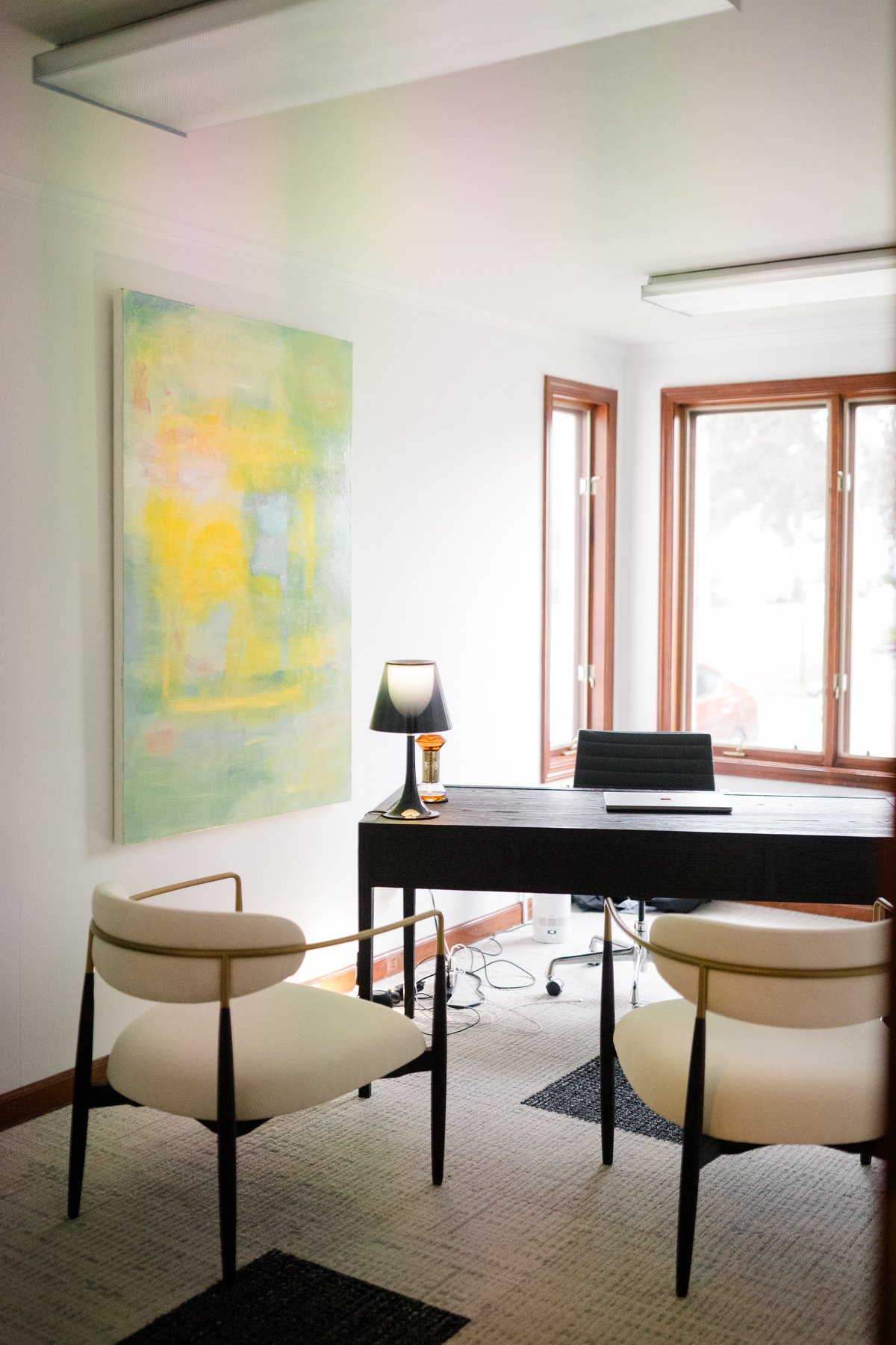 Office at CMHS, 51 Cherry Street, Milford: desk, two chairs and abstract painting